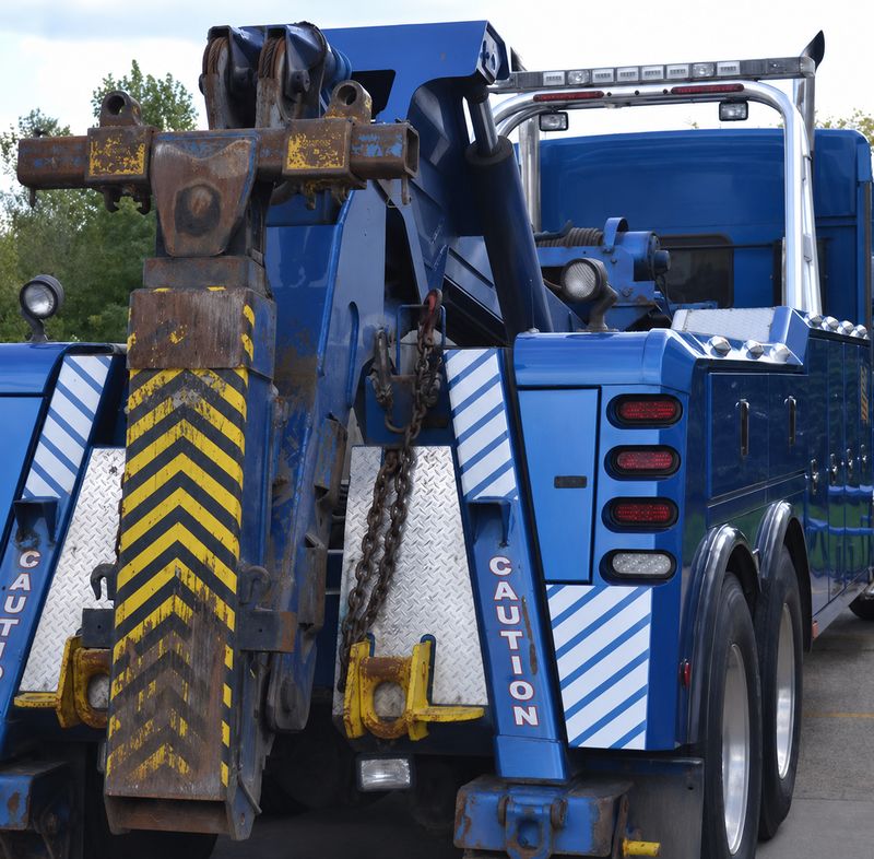 Heavy-duty tow truck with winch rigging ready for recovery work in Mesquite, TX